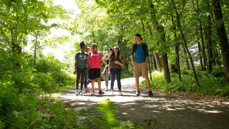St. Scholastica students walking on the St. Scholastica Duluth campus trails.